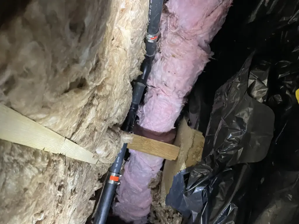 Insulation and pipes in crawl space
