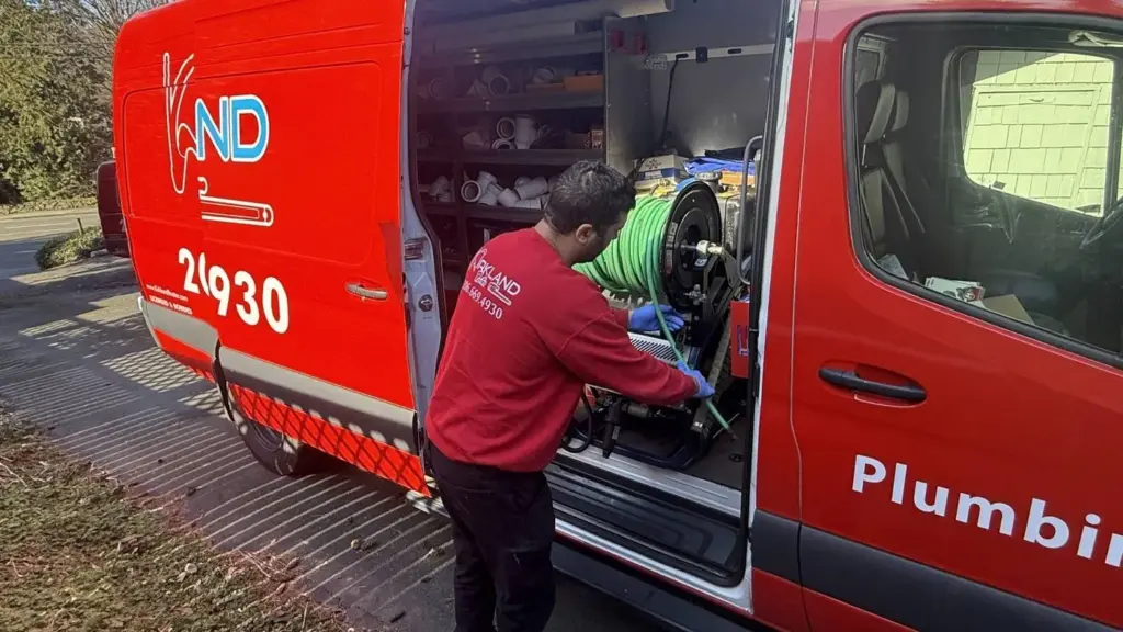 Plumber working in service van